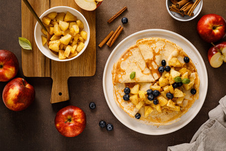 Crepes with caramelized cinnamon apples, top viewの写真素材