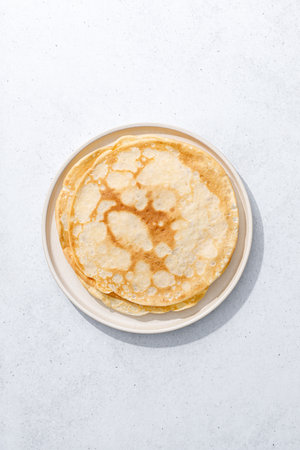 Crepes. Thin crepes on a plate. Top view