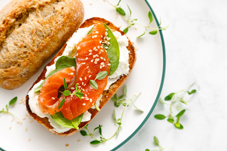 Salmon salted sandwich with spinach and cream cheese, top down viewの写真素材