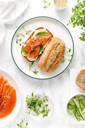 Salmon salted sandwich with spinach and cream cheese, top down viewの写真素材