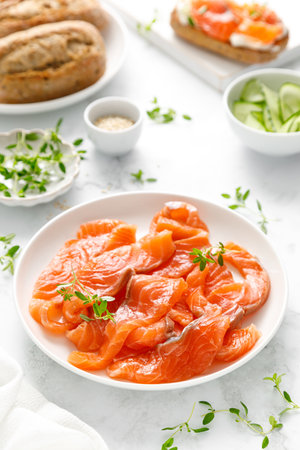 Salted salmon sliced on plate on a white backgroundの写真素材