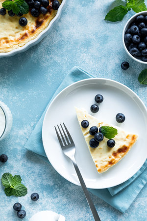 Cottage cheese cheesecake slice with fresh blueberry, top down viewの写真素材