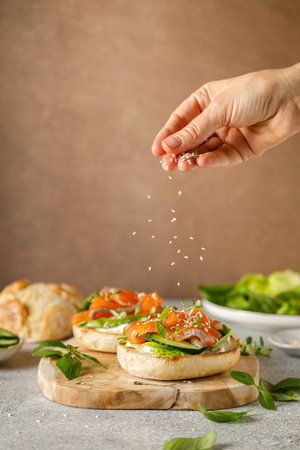 Salmon sandwiches with cream cheese, fresh romaine lettuce and cucumberの写真素材