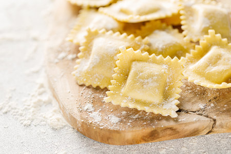 Cooking ravioli on a floured kitchen tableの写真素材