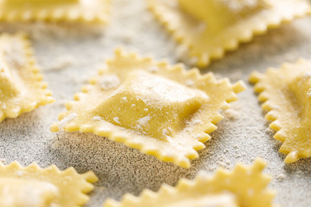 Cooking ravioli on a floured kitchen tableの写真素材