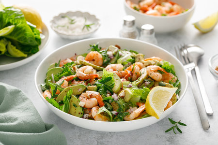 Shrimp avocado salad with lettuce and arugula.の写真素材