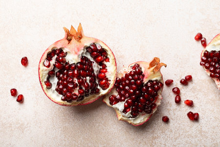 Pomegranate. Fresh organic juicy pomegranate fruit pieces. Pomegranate seeds, grains, top view.の写真素材