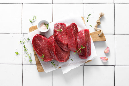 Beef. Raw beef tenderloin meat, beef steaks with ingredients for cooking. Top viewの写真素材