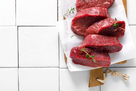 Beef. Raw beef tenderloin meat, beef steaks with ingredients for cooking. Top viewの写真素材
