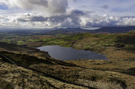 High view of Cwmystradllyn Reservoir from Mynydd Oerddwr, North Walesの写真素材