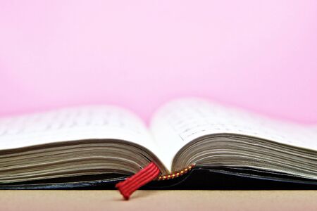 Close-up of open book on the floor selective focus and shallow depth of fieldの写真素材