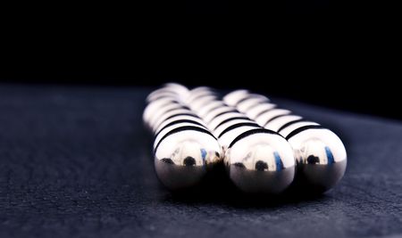 Group of metal silver balls on a dark backgroundの写真素材