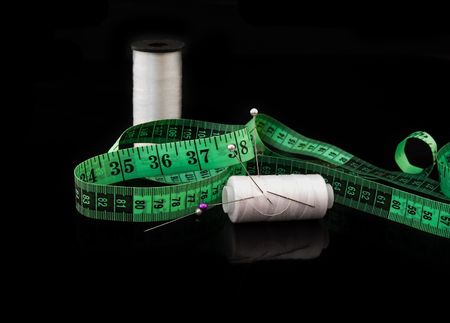 Measuring tape on black backgroundの写真素材