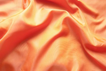 Elegant background in the form of orange silkの写真素材