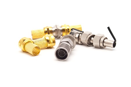 gilded television connectors on a white backgroundの写真素材