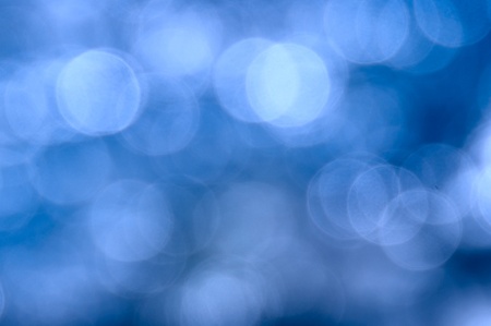 Abstract dark blue background in the form of bright various bokehの写真素材