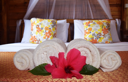 Lovely bed in the lovely cottage.の写真素材