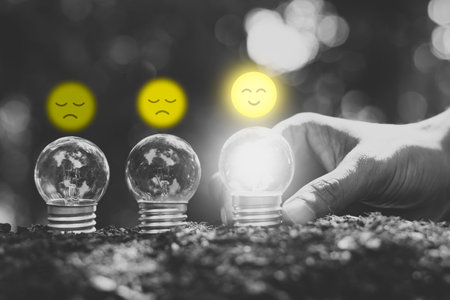 The light bulb is illuminating the ground and the technology icon is on the top.の写真素材