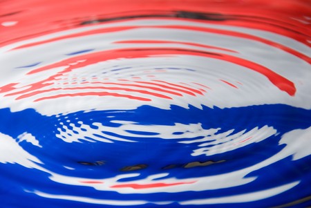 A water droplet against a Dutch / Netherland flag colorsの写真素材