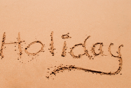Holiday writting on the sand at a beachの写真素材