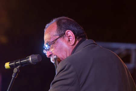 Bangalore, India - February 10, 2018: American Jazz musician Ernie Watts plays the flute as he performs onstage in Bangalore, Indiaのeditorial素材