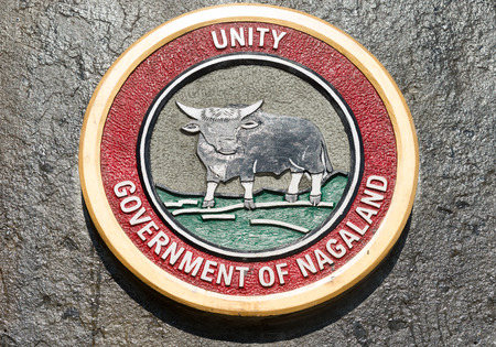 Kohima, Nagaland, India - January 22 2019: The official emblem of the state Government of Nagaland on a stone surface.のeditorial素材