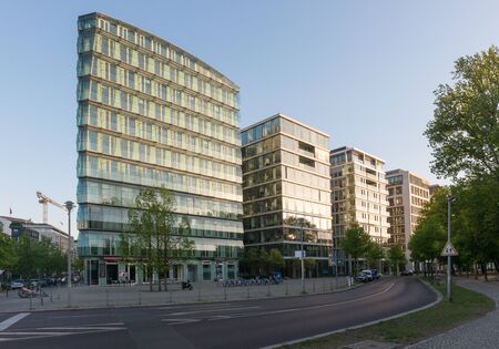 Berlin, Germany - April 29, 2019: Modern apartment buildings lit by the morning sun in Berlin,...