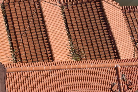 Background ornament terracotta red tiles on roof in the Mediterraneanの写真素材