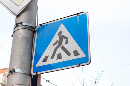 Triangular pedestrian crossing sign. Blue symbol for cars, zebraの写真素材