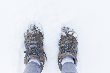 Boots in the snow. Wintertime . Woman footsの写真素材