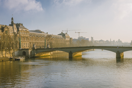 Bridge in Paris France. Senna river, sunlight, winter morningの写真素材
