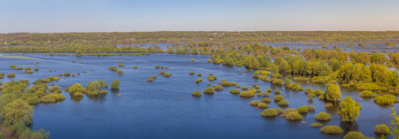 Aerial landscape panoramic view on Desna river with flooded meadows and beautiful fields. View from high bank on annual spring overflow . Novgorod-Siversky, Ukraine.の写真素材