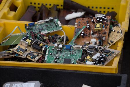 Set of the old computer electric equipment plumes in the old boxes on the flea market Kiev, Ukraine near Petrovka metro station Pochainaの写真素材