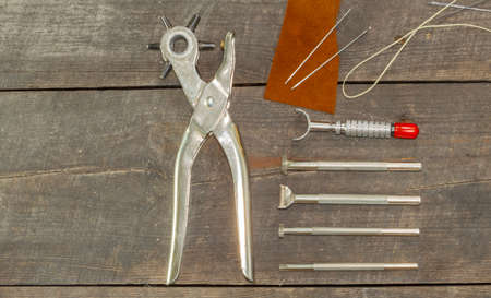 Leather instruments kit. Flat set. second hand leather tooling stamps for handmade leather workshop.の写真素材