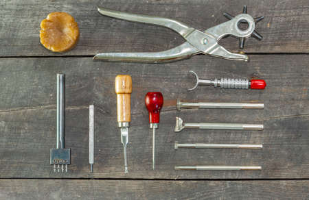 Leather instruments kit. Flat set. second hand leather tooling stamps for handmade leather workshop.の写真素材
