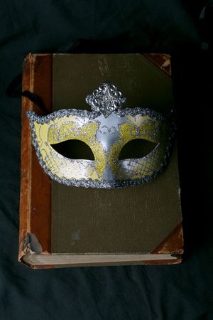 rare old book on black fabric very Antique maskの写真素材