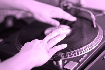 scratch battle of dj playing on his vinyls hand onの写真素材