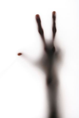 blurry scary horror hand silhouette on whiteの写真素材