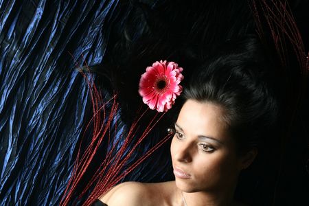 beautiful pink flowers in girl hairの写真素材