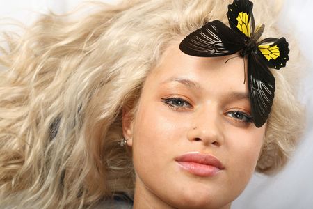 girl and colorful butterfly near herの写真素材