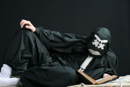 black mime portrait white eyes rope on neckの写真素材