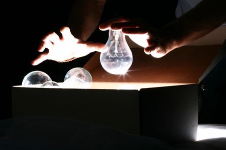 hand steal ideas lamps from box の写真素材