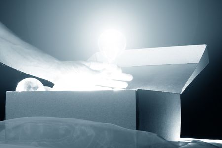 hand steal ideas lamps from box の写真素材