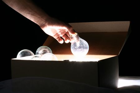 hand steal ideas lamps from box の写真素材