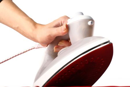 girl hand have to iron red materialの写真素材