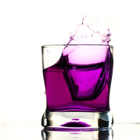 coctail drink splash isolated on whiteの写真素材