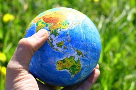 globe of planet earth in man hand
