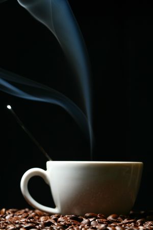 coffee beans and white hot cup of drinkの写真素材