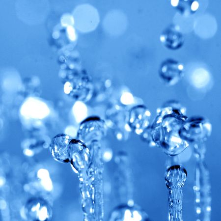 water drops in motion macro close upの写真素材