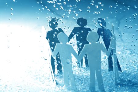 paper team linked together under rain weather conceptの写真素材